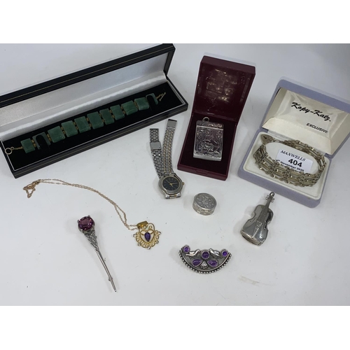 404 - A selection of white metal items:  an aide memoire; pill box; Celtic brooch etc.