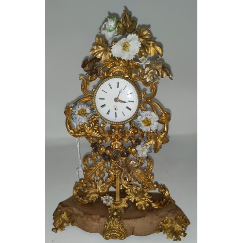 136 - An unusual 18th century Rococo mantel clock formed from pierced and embossed gilt metal foliage with... 