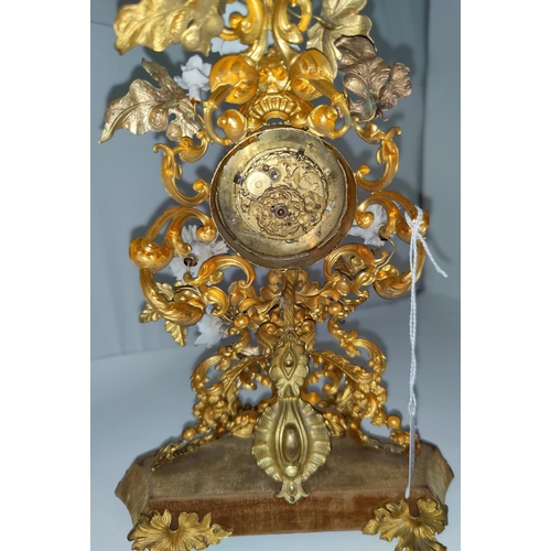 136 - An unusual 18th century Rococo mantel clock formed from pierced and embossed gilt metal foliage with... 