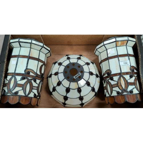152 - A pair of Tiffany style leaded light lampshades, 30cm and another 25cm diameter