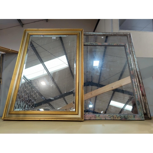 9 - A bevelled edge wall mirror in rectangular gilt frame; 2 others