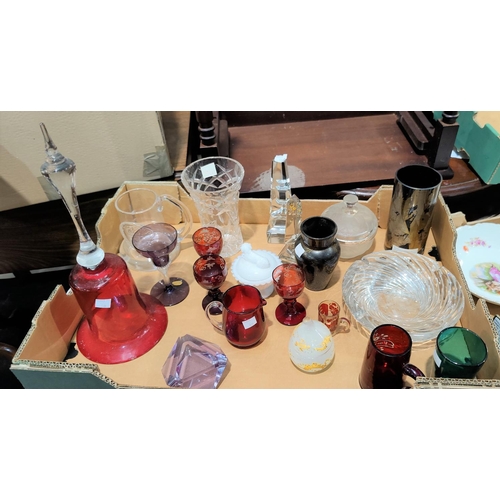 50 - A cranberry glass bell; other glassware; a selection of miniature items