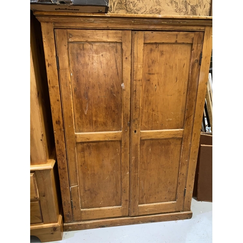 527 - A Victorian stripped pine two door side cabinet