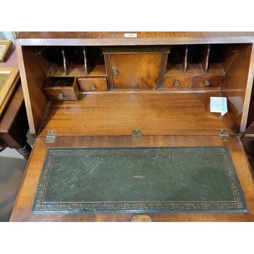 632 - A Reprodux mahogany bureau with fall front and 4 drawers