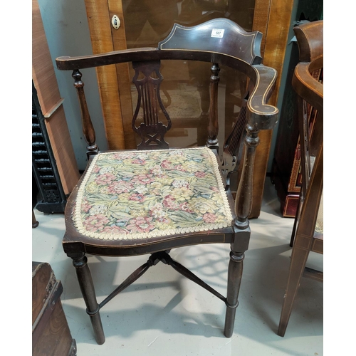 507 - An Edwardian inlaid corner armchair