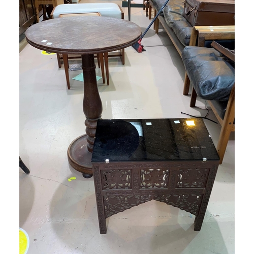 521 - A middle eastern table with rectangular glass top, 41 cm; a pedestal table with circular top