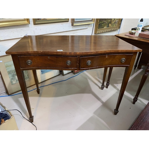 640 - A reproduction mahogany side table in the Regency style with serpentine front, fitted 2 drawers