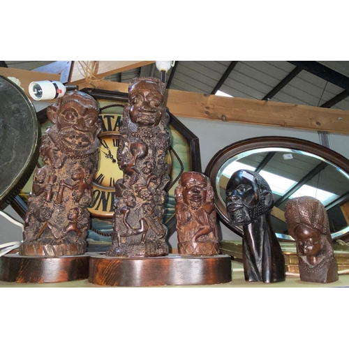 92 - Two African figures with extensive carving, converted to table lamps; other African carvings