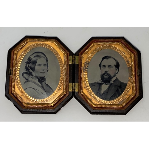 313 - Mid Victorian tintype husband and wife photos in hinged embossed composition frame