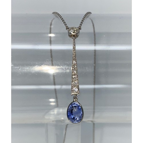 360C - An Art Deco white metal drop pendant with six graduating diamonds to the seam, a diamond to the top ... 