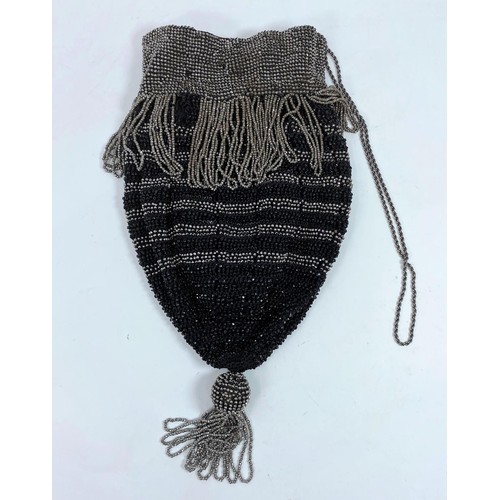 399 - A drawstring purse with faceted cut steel and French jet beads
