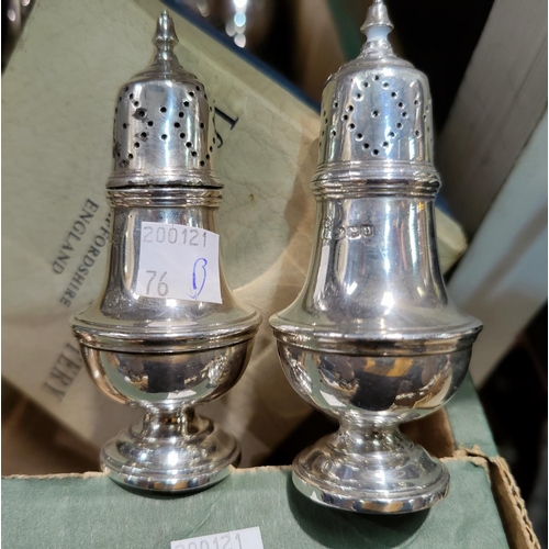 76B - A pair of hall marked silver pepper pots, a small selection of silver plate