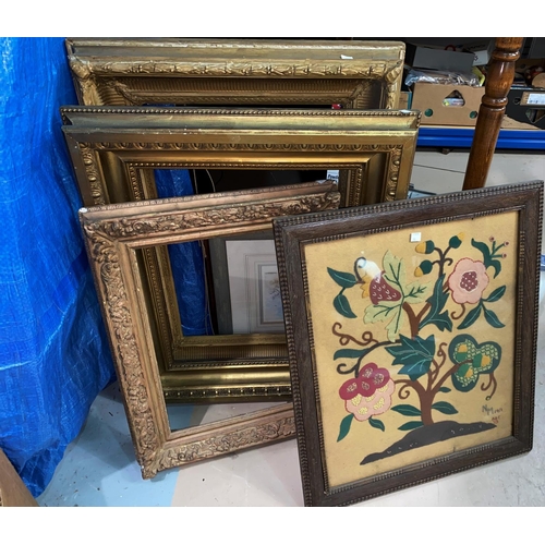 15 - A needlework firescreen and similar picture; 3 heavy gilt picture frames & a standard lamp
