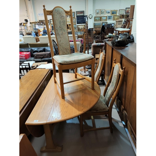 481 - A modern Ercol light oak dining table with drop leaf and 4 chairs with carved wheat pattern