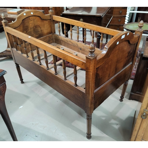 464 - A baby's stained wood cot in the continental style, 115 x 64 cm