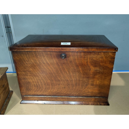 128 - An early 20th century oak stationery cabinet with out-folding writing slope, fitted interior with dr... 