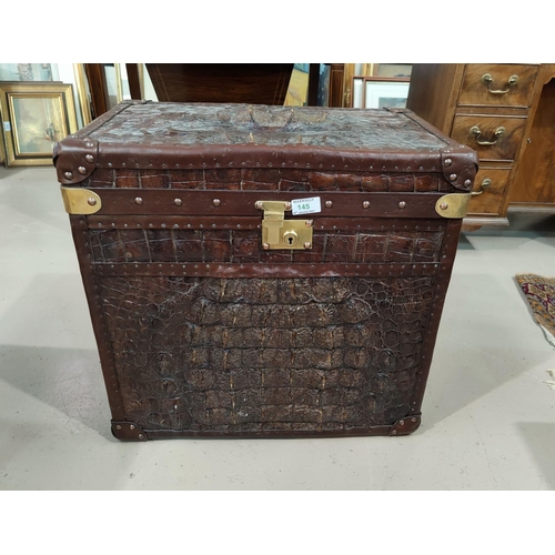 145 - A Colonial style travel trunk covered in crocodile skin effect