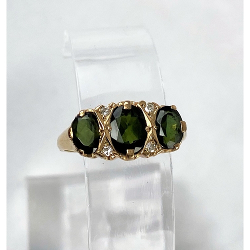 288 - A 9 carat hallmarked gold ring set with 3 small Tourmalines and 4 small diamonds
