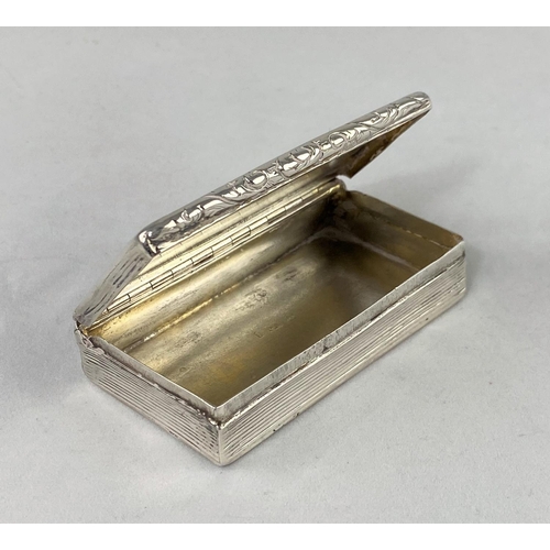 310 - A Georgian rectangular silver snuff box with engine turned ribbed decoration and embossed border (no... 