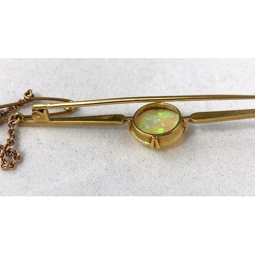 337 - A yellow metal bar brooch set circular domed opal, diameter 10 mm, inscribed '832', 4 gm, tests as c... 