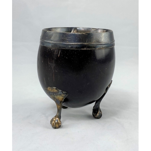 351 - A Georgian coconut cup with hallmarked silver rim and mounts (marks worn; cup cracked)