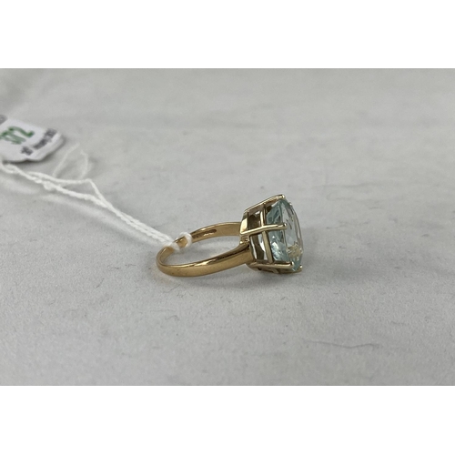 372 - A lady's 9 carat hallmarked gold dress ring set large aquamarine coloured stone, size N.5, 4.3 g gro... 