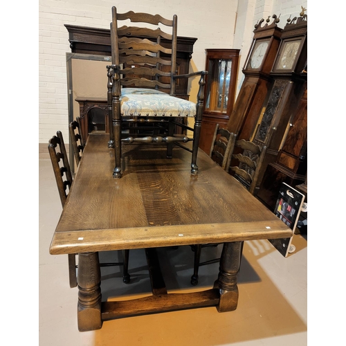 475 - A 'Royal Oak' reproduction oak refectory table with turned legs and a set of 6 oak chairs with uphol... 