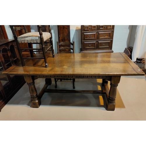 475 - A 'Royal Oak' reproduction oak refectory table with turned legs and a set of 6 oak chairs with uphol... 