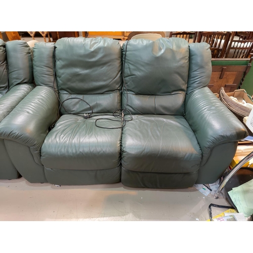 477 - A 2 seater green leather reclining settee