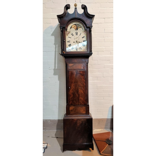 489 - An early 19th century figured mahogany longcase clock with brass ball finial, swan neck pediment and... 