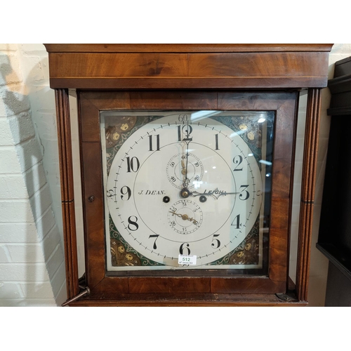 512 - An early 19th century inlaid mahogany longcase clock with brass finials and square reeded columns to... 