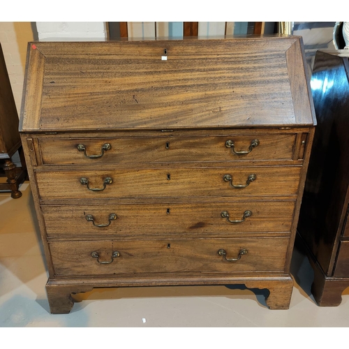 562 - A Georgian mahogany fall front bureau with fitted interior and 4 long graduating drawers, on bracket... 