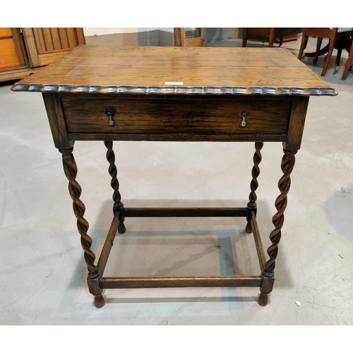 582 - A 1930's oak occasional table with rectangular top, frieze drawer, on barley twist legs