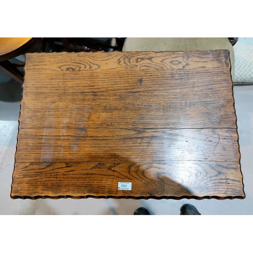 582 - A 1930's oak occasional table with rectangular top, frieze drawer, on barley twist legs
