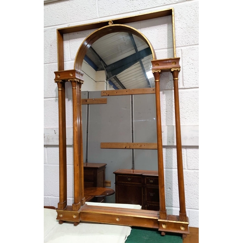 685 - An overmantel mirror in architectural arch top frame, flanked by double columns, 112 x 71 cm