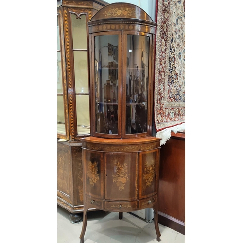 689 - An Edwardian mahogany full height bow front corner display cabinet with extensive floral marquetry i... 