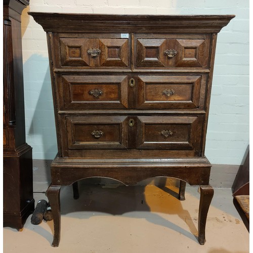 579 - A late 17th/early 18th century country made oak chest on stand, the upper section with 2 long and 2 ... 