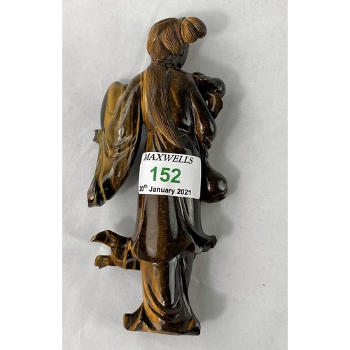 152 - A Chinese figure carved from Tiger's Eye, woman holding  fan, height 17cm (head re-attached)