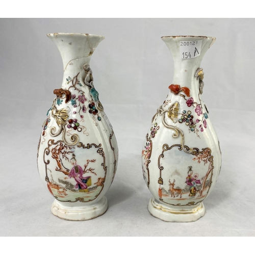 154a - A pair of Chinese vases with relief panel decoration of flowers and vines, height 17cm (damaged and ... 