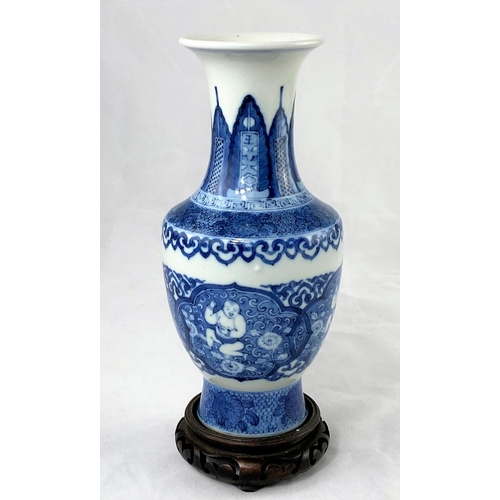 157a - A Chinese blue and white vase on wooden stand bearing 6 character mark to base, height 21.5cm