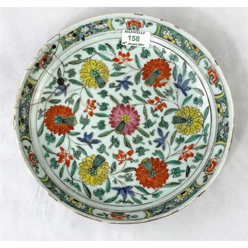 158 - A Chinese famille verte charger decorated with flowers etc, bearing old metallic repairs, diameter 2... 