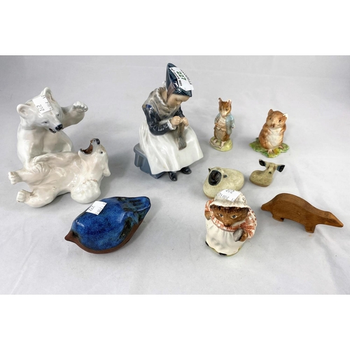 227 - A Royal Copenhagen figure of a seated Amish girl and a group of 2 fighting polar bears; 3 Beswick Be... 