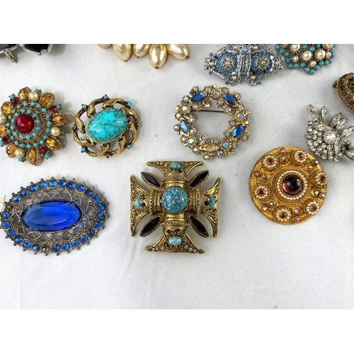359 - A selection of decorative costume brooches set multi-coloured stones, from the mid 20th century