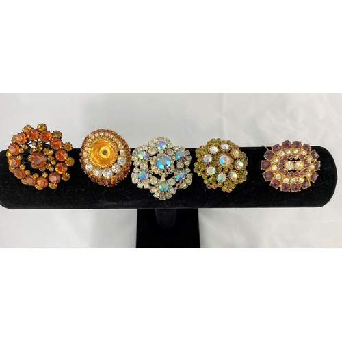 359 - A selection of decorative costume brooches set multi-coloured stones, from the mid 20th century