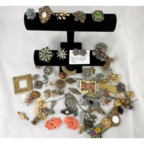 360 - A large selection of multi-coloured costume brooches from the mid 20th century