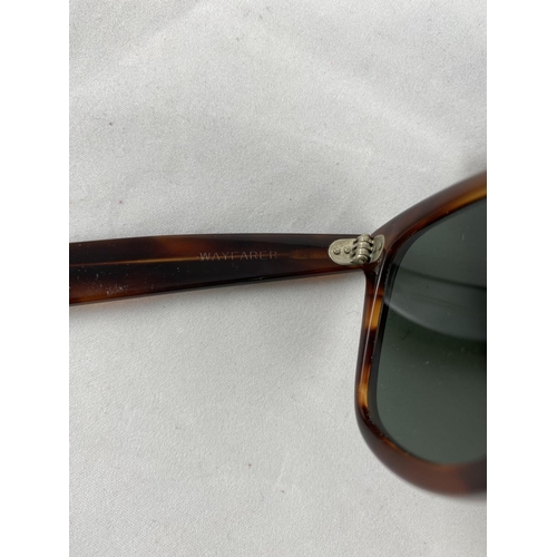 367 - A pair of black sunglasses, Ray-Ban B&L Wayfarer Nomads, in soft case; a classic pair of Ray-Ban tor... 