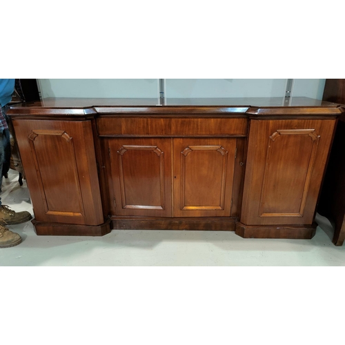 470 - A large Victorian mahogany reverse breakfront 4 door sideboard with frieze drawer, double cupboard a... 