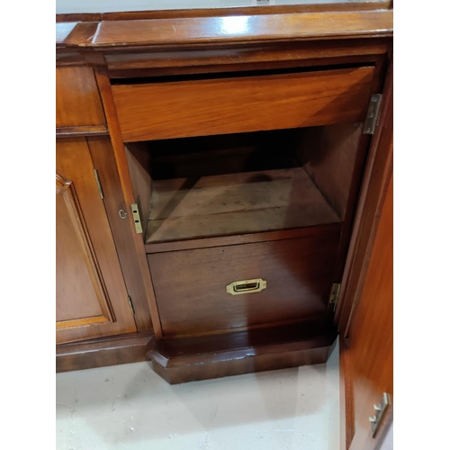 470 - A large Victorian mahogany reverse breakfront 4 door sideboard with frieze drawer, double cupboard a... 