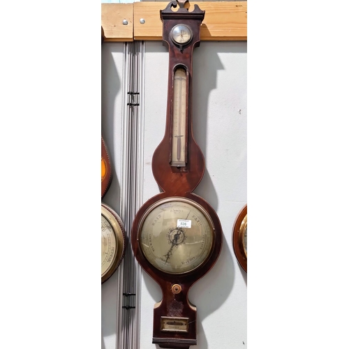 526 - A 19th century large mercury column barometer with thermometer   in banjo shaped case with ebony and... 