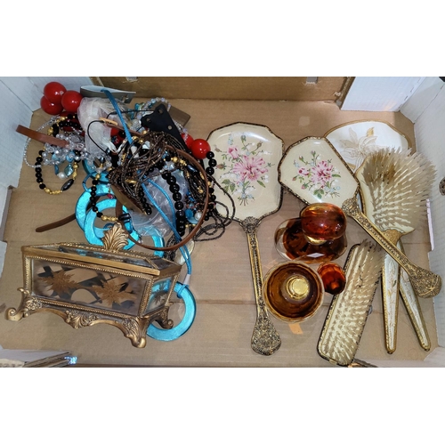 57 - A small mirrored casket; 2 scent bottles; part dressing table sets; costume jewellery; etc.